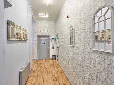 Interior hallway with patterned walls and decorative elements
