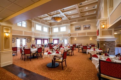Elegant dining room with tables set for meals