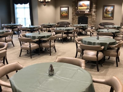 Dining room with tables and chairs set up