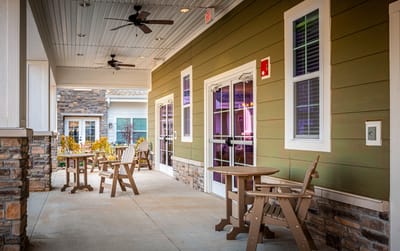 Outdoor seating area with tables and chairs