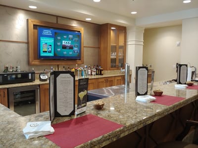 A well-designed bar area with drinks and menus.