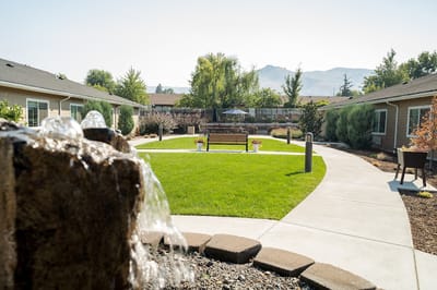 Outdoor courtyard with seating and a fountain