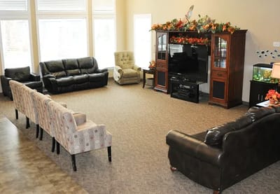 Common area with seating and television.