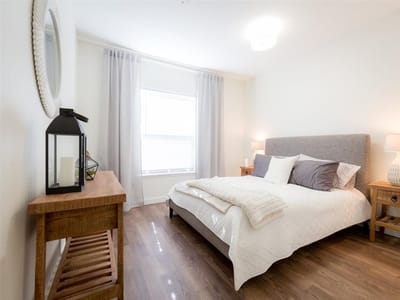 Bright and airy resident room with bedding