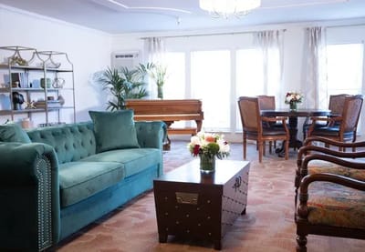 Bright interior common area with seating and plants