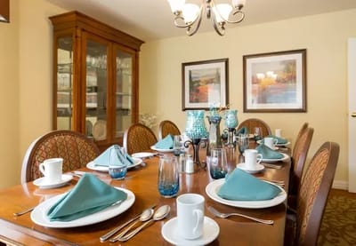 Dining room set for a meal with decorated table