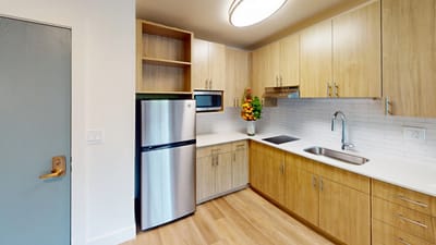 Modern kitchen area in a residential suite