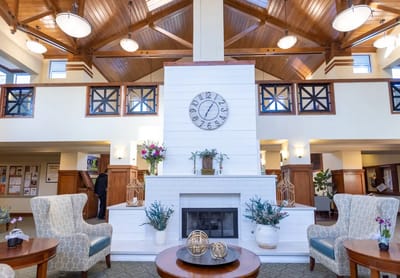 A cozy common area with seating and a fireplace
