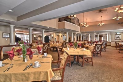 Dining room with set tables and decorations