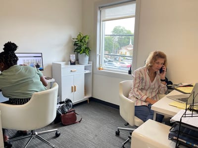 Office setting with staff members working