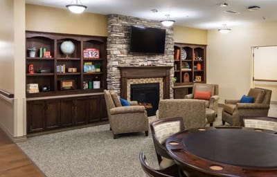 Cozy common area with seating and a fireplace