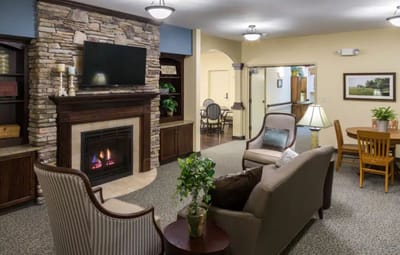 Interior common area with seating and a fireplace