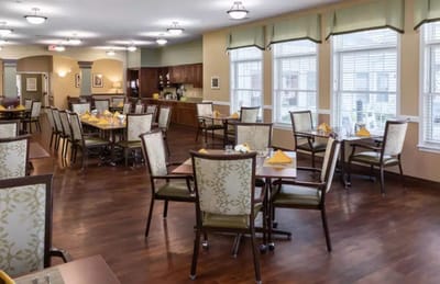 Dining area with neatly set tables and chairs