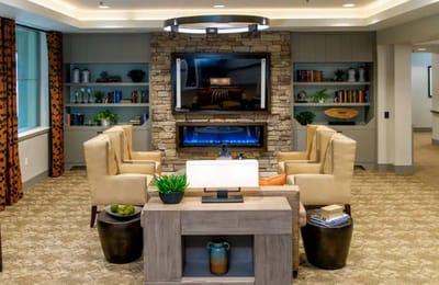 Cozy common area with seating and a fireplace