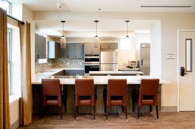 Bright interior kitchen area with seating