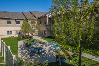 Outdoor courtyard with seating and trees