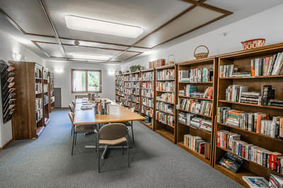 A bright library filled with books and tables