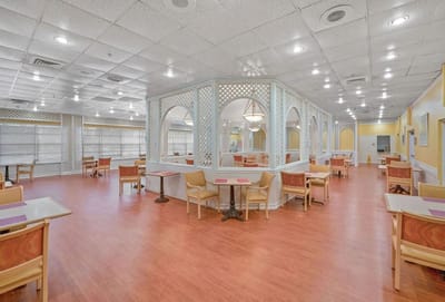 Interior view of a dining area with chairs and tables