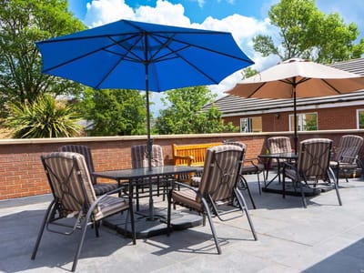 Outdoor patio with tables and umbrellas