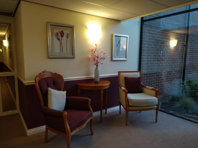 Cozy seating area with floral decor and natural light
