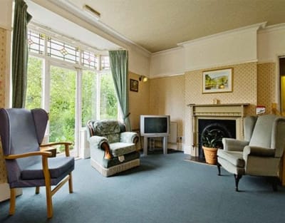 Cozy common area with comfortable seating and TV