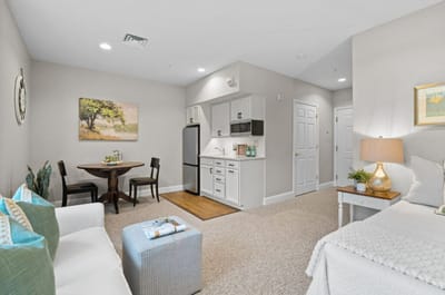 Cozy resident room with kitchenette and sitting area