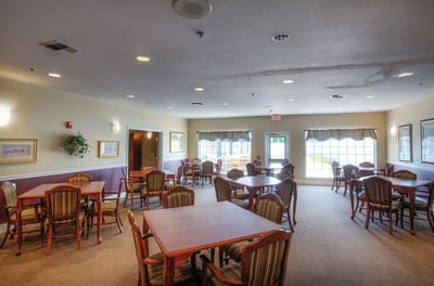 Bright common area with tables and chairs