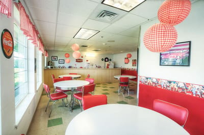 Bright dining area with retro decor and circular tables