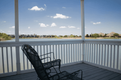 View from a lakeside porch with a rocking chair