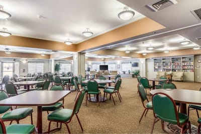 Bright indoor dining area with tables and seating