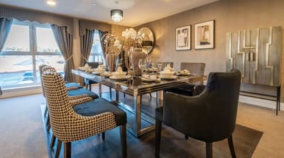 Elegant dining room setup with table and chairs