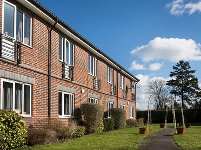 Exterior view of the residential building with garden