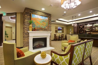 Cozy lobby area with seating and fireplace