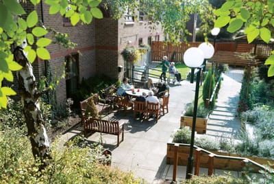Residents enjoying time outdoors in a garden area