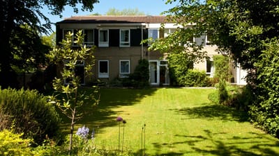 Exterior view of the facility surrounded by green space