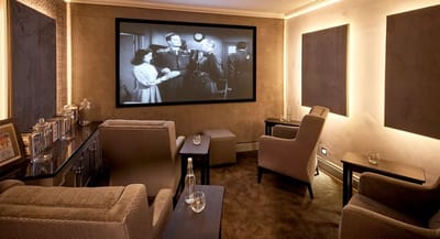 Comfortable lounge area with a classic movie showing