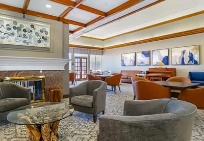 Cozy common area with comfortable seating and artwork
