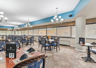 Dining area with tables and chairs set up for residents