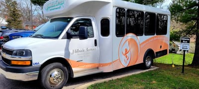 Facility shuttle bus parked at Hillside Terrace