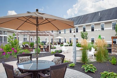 Outdoor garden area with seating and umbrellas