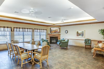 A cozy common area with seating and a fireplace