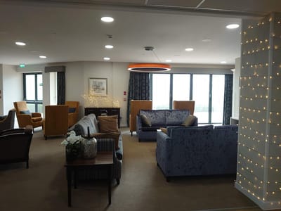 Interior common area with seating and decorative lights