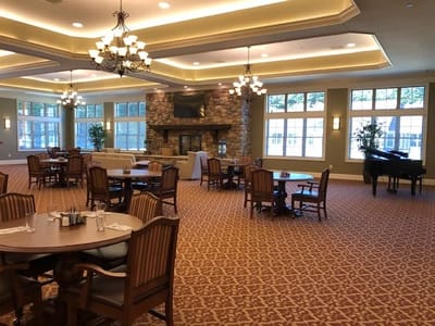 Common area with dining tables and piano