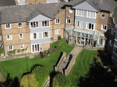 View of building exterior with outdoor garden area