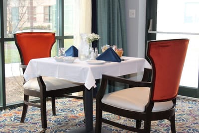 Dining table set for a meal in a well-lit dining area
