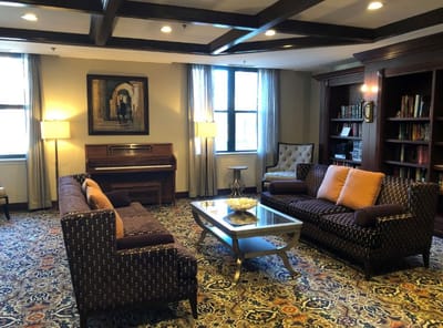 Interior common area with seating and piano