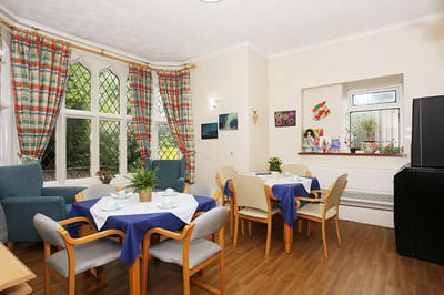 Bright dining area with tables and chairs