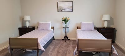 Private resident room with two beds and decorations