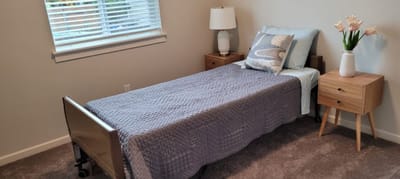 Cozy private resident room with a bed and decor