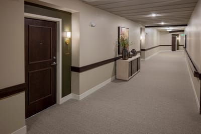 Bright and welcoming hallway with room doors